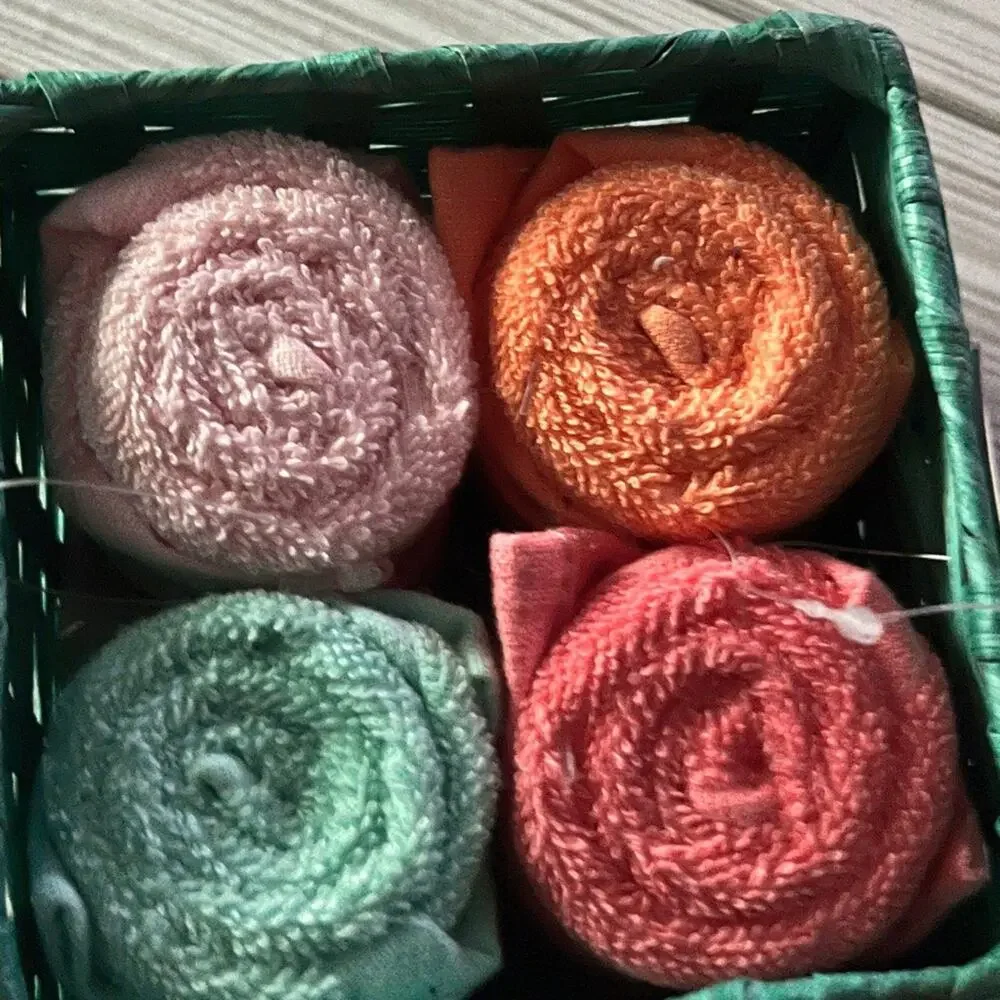 Colorful Rolled Wash Cloths in Basket